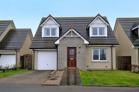 Front of 12 Angus Avenue, detached house with garage, driveway and small grass area at front