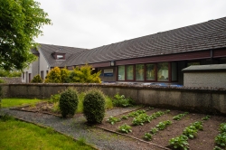 Jamie Nicol Court sheltered housing image of building and garden in front of it