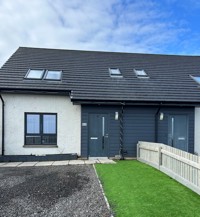 Front of the Brae Road property in Gourdon, semi detached house with driveway in form of the house and grass area on the right