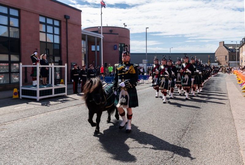 The Scots Regiment on parade in Peterhead as it passes Buchan House led by Shetland pony mascot Cruachan the fourth