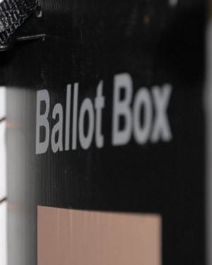 A photo of a black ballot box, with the words 'Ballot Box' in white text. 