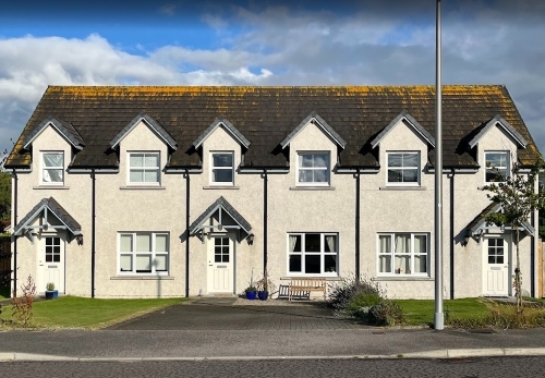 Front of 11 Clune Gardens Woodlands Of Durris, mid terrace house with paved driveway