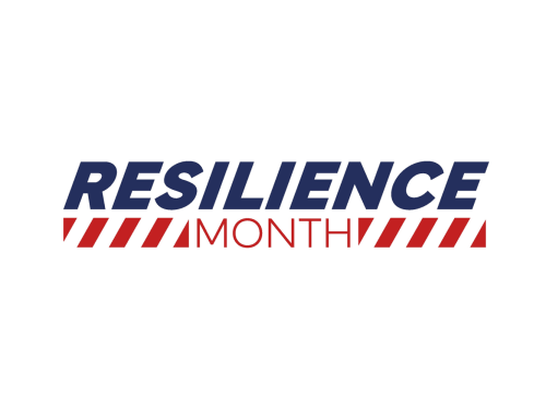 A Reslience Month logo, with the word resilience in blue text in capital letters, above the word month in capital red text, with red chevrons either side of the word. 