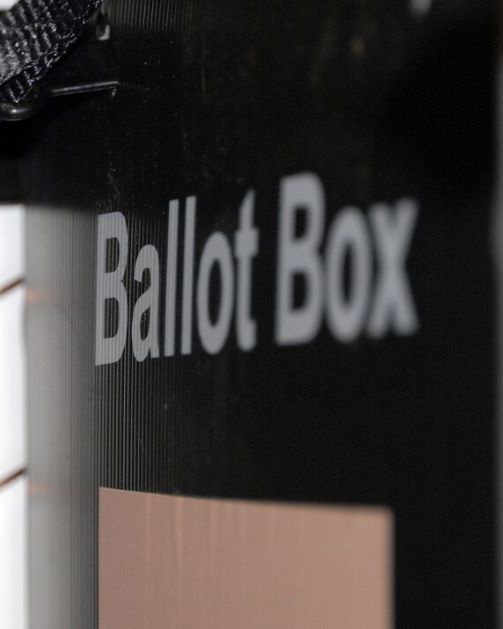 A black ballot box with the words 'Ballot Box' in white text. 