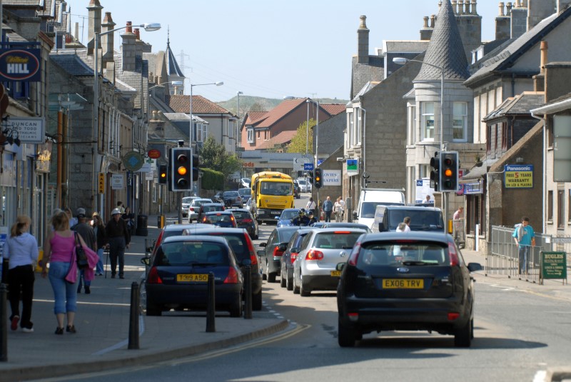 A picture of traffic in Inverurie town centre with pedestrians