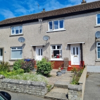 Front of 4 Smith Road, mid-terraced house with front garden and paved path to front door