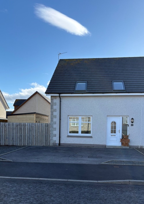 Front of 56 Ladysbridge Drive, detached house with paved driveway