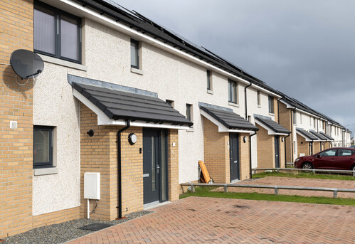 A photo of the Bittockie Way housing development in Fraserburgh, showing a row of houses and their driveways. 