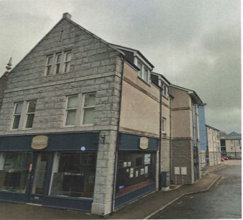 Front of the building showing a shop unit on the ground floor and flats above it