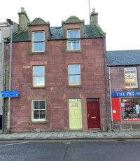 Front of the property, 3 storey high with red brick, pavement outside